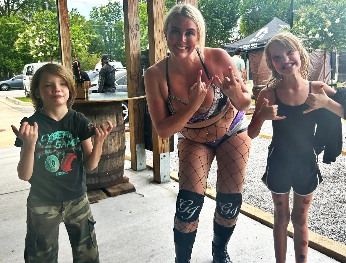 Erin and family with a Deep South Wrestling performer